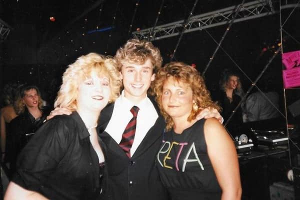 Andy B. Barker posted: "Moulin Rouge - met the wife there 37 plus years ago." Photo shows two Moulin Rougers with the club's DJ Nick Jones.