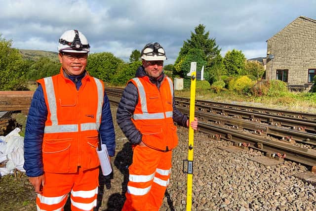Rolando Navarro (L) and Colin Phillips (R) by the railway at Chinley signal box