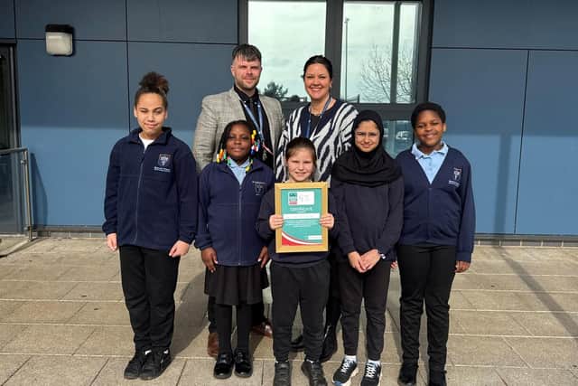 Bluecoat Primary Headteacher Ben Jackson(L) and Safeguarding Lead Kathryn Brown (R) with several young carers.