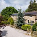 The gravelled driveway provides parking for five vehicles and leads to a double garage. Two sets of stone steps rise to a stone flagged seating terrace which provides access to the main entrance door and bedroom five.