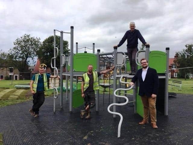 Councillors Damian Greenhalgh and Graham Oakley with the contractors.