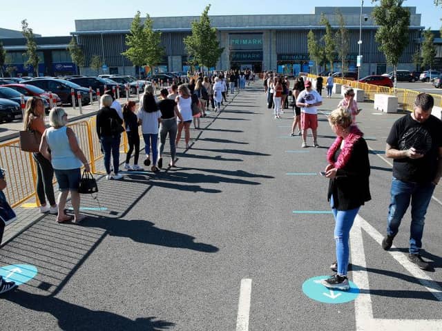 Thousands of shoppers were seen queuing for reopened shops in England