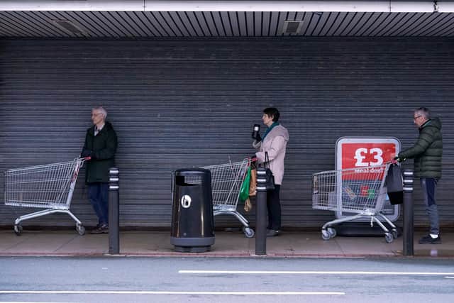 Shoppers queue outside Sainsbury's (Photo by Christopher Furlong/Getty Images)