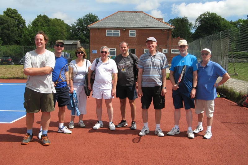 Players at New Mills Tennis Club take to the courts.
