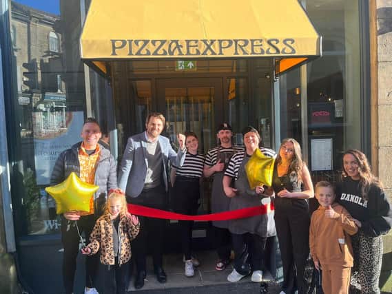 High Peak family cut the ribbon at the recently refurbished Pizza Express in Buxton. Photo submitted