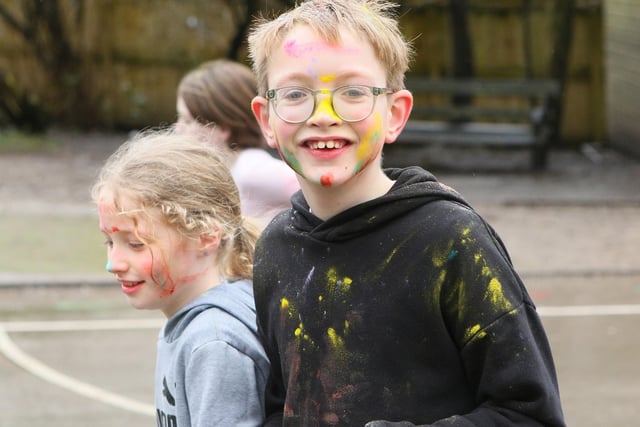 A colourful face for this youngster at St Anne's colour run. Photo Jason Chadwick