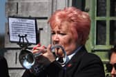 Kim Flanagan of the Fairfield Band plays the last post. Photo Chris Clegg