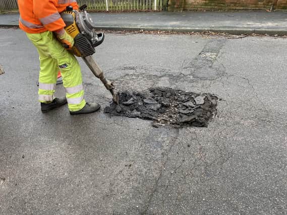 Pictured Is A Derbyshire County Council Worker Repairing One Of The Many Potholes On The County\'S Roads