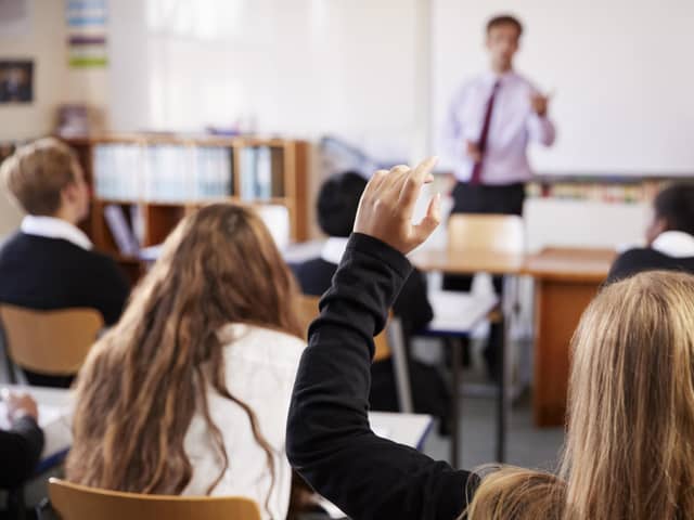 Student puts their hand up.