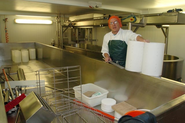 Alan Salt with a large cheese making vat which was made for the Hartington factory where he and Adrian once worked, pictured in 2012