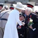 Queen Camilla speaks to Royal Navy D-Day veteran Albert Keir, 98, following the UK Ministry of Defence and the Royal British Legion’s commemorative event at the British Normandy Memorial to mark the 80th anniversary of D-Day on June 06, 2024 in Ver-Sur-Mer, France. Normandy is hosting various events across significant sites such as Pegasus Bridge, Sainte-Mère-Église, and Pointe du Hoc, to officially commemorate the 80th anniversary of the D-Day landings that took place on June 6, 1944. (Photo by Gareth Fuller - Pool/Getty Images)