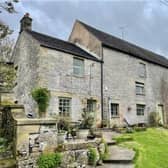 The two-bedroom home at Earl Sterndale represents about a third of the building and is attached to two uncoverted barns.