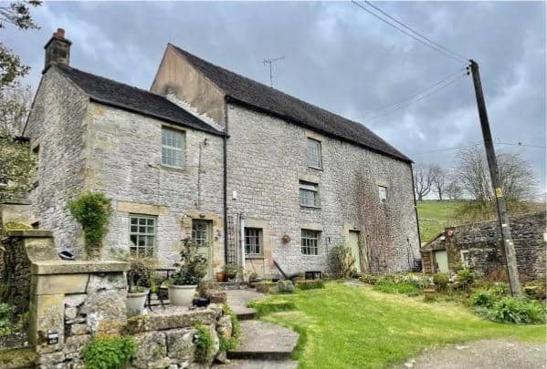 The two-bedroom home at Earl Sterndale represents about a third of the building and is attached to two uncoverted barns.