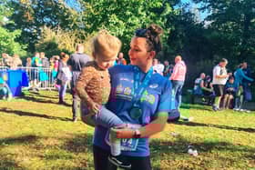 Sophie Elliott celebrates completing a previous race with her daughter Grace.