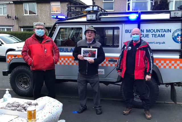 Members of Buxton Mountain Rescue Team making a special call-out to celebrate a former team member's 80th birthday