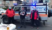 Members of Buxton Mountain Rescue Team making a special call-out to celebrate a former team member's 80th birthday