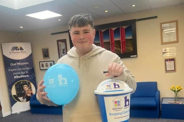 A fundraising pupil at St Thomas More with his collection bucket for Blythe House Hospice. Photo submitted