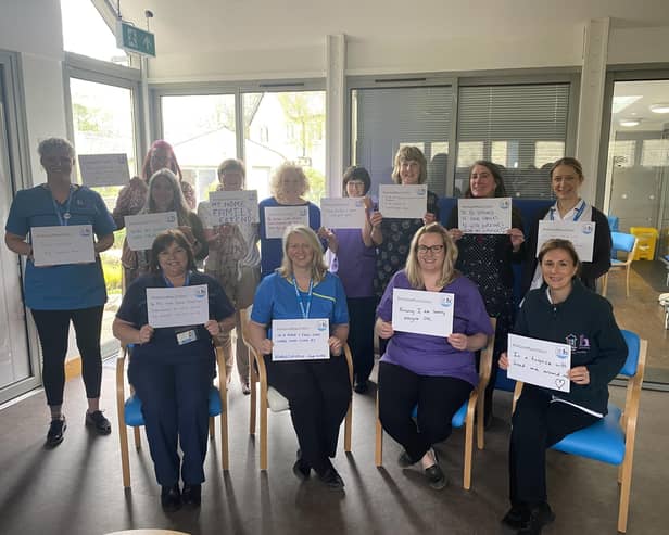 Blythe House clinical staff holding up signs showing their wishes for the end of their lives