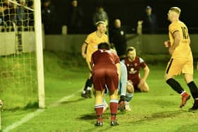 The big breakthrough - an own goal sets New Mills on their way. Photo by John Fryer.