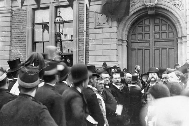 Crowd outside Buxton Town Hall sometime around the turn of the century. The black flag suggests that the crowd is waiting for an announcement, possibly Queen Victoria's death in 1901.