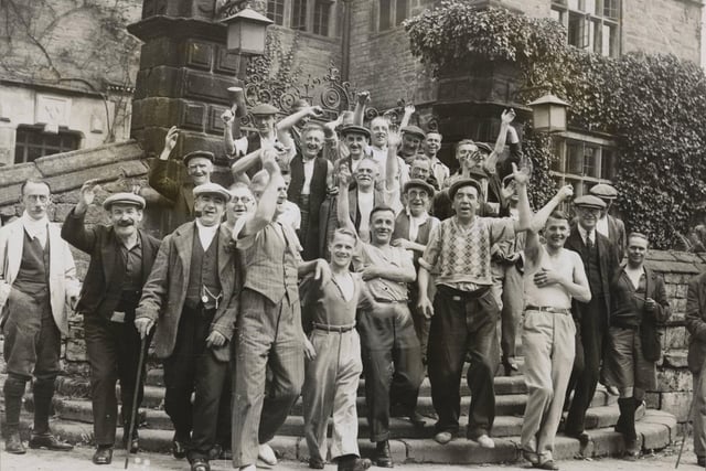 Thirty five unemployed men from unemployed occupational clubs enjoying a ten days camping holiday at Derwent Hall, where they spent their time in organised games and rambles. The holiday was intended to set them up to face the winter. Some of the men pictured in happy spirits as they leave the hall for a day in the country. Derwent Hall was on the site of what later became the Ladybower Reservoir.