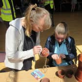 Making flowerpot people at the Rotary Club of Buxton Summer Fair in the Pavilion Gardens.