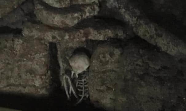 Skeleton in the wall at the Peak Buildings