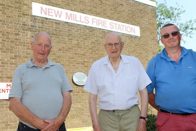 Church Stewards Mike Doughty and Alan Woolley with witness Geoffrey Woolley at New Mills Fire Station which now stands on the site. The plaque commemorates the victims.