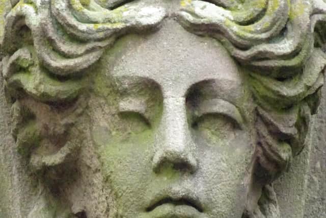A "sublime" grotesque on the keystone over a door on Terrace Road