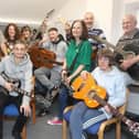 The guitar group at Zink with their newly donated instruments