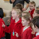 The choir from Buxton Infants School entertain home owners at  the new retirement complex in Buxton, Devonshire Place.