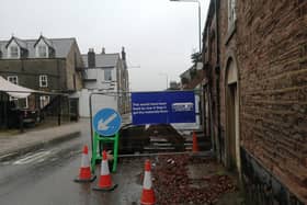 Residents of Chapel-en-le-Frith have put up tongue in cheek advertising around Derbyshire's longest running temporary traffic lights. Photo submitted