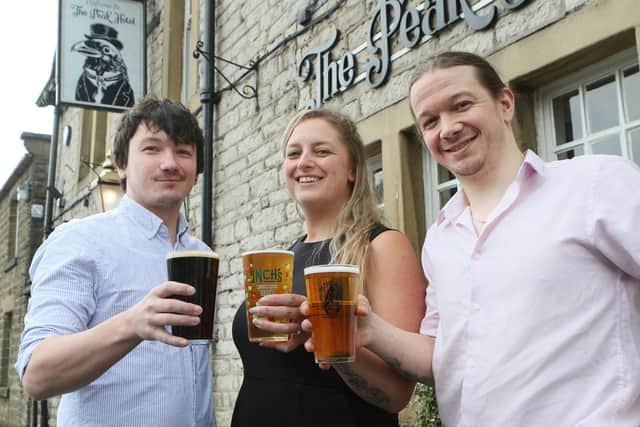 Sarah Hunt, Graham Watson and Jack Watson outside the Peak Hotel which will be holding its first beer and cider festival later in the year. Pic Jason Chadwick