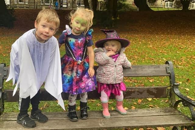 Three dressed up ghouls and witches taking part in the Pavilion Gardens Halloween trail over the half term