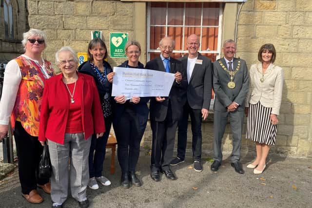 From left, Connex volunteer Pat Gyongyosi, client Edna Campbell, befriending team leaders Emma Wilson and Rachael Mitchell, Roy Pickles and Roddie McLean from the Hall Bank Trust, and the Mayor and Mayoress of High Peak, Paul and Mary Hardy.