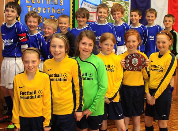 Fairfield Endowed Junior School's winning girls five a side football team and the boys team who came second.