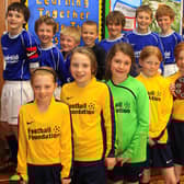 Fairfield Endowed Junior School's winning girls five a side football team and the boys team who came second.