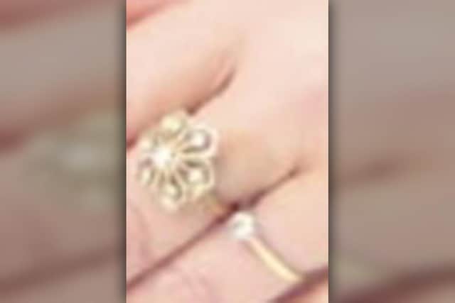 The other ring which was stolen. While the photo provided is not of the highest quality, it is the only image available at this time.