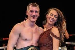 New world champion Jack Massey celebrates with girlfriend Amber.