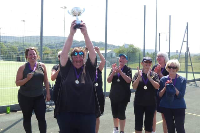The Hathersage team lift the trophy as Peak District Walking Netball Champions