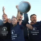 Buxton's players celebrate championship glory.