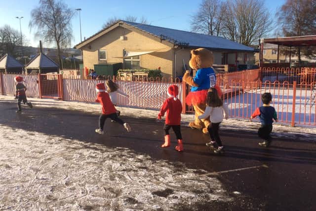 The Blythe House Hospice mascot running with the children from Fairfield Infant and Nursery School. Pic submitted