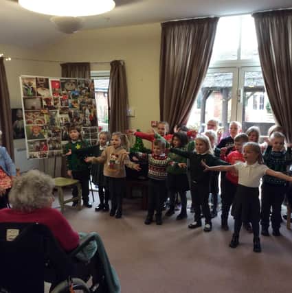 Youngsters from Combs Infants brought some Christmas cheer to elderly residents of the community. Photo Combs Infants