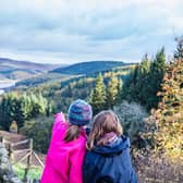 Two young people look out across the Peak District National Park from Lockerbrook Farm centre 