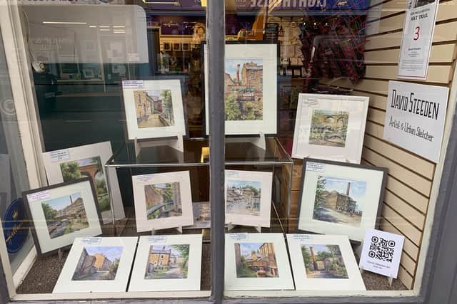 Display of work by David Steven, Artist and Urban sketcher in shop window on Market Street.