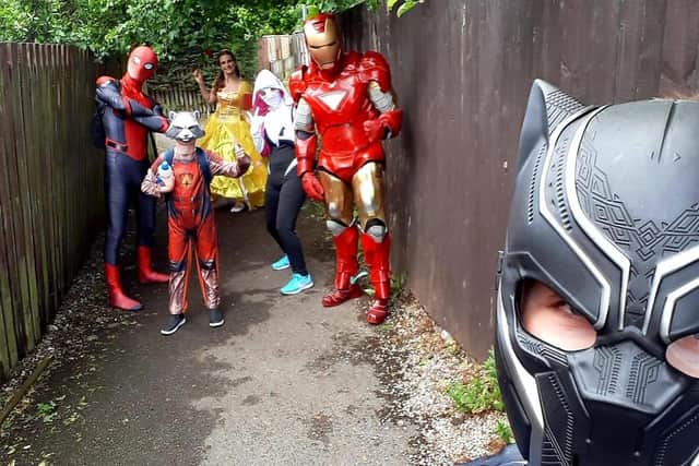 Andy's son Nathan, 12, - dressed as Black Panther - grabs a quick selfie of the costumed Covid-19 fighters on the prowl