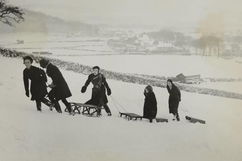 Even over a 100 years ago when it snows the form of entertainment always stays the same.
