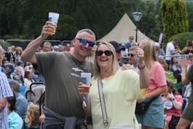 Two revellers raise a glass at Buxton's Eat in the Park. Photo Jason Chadwick