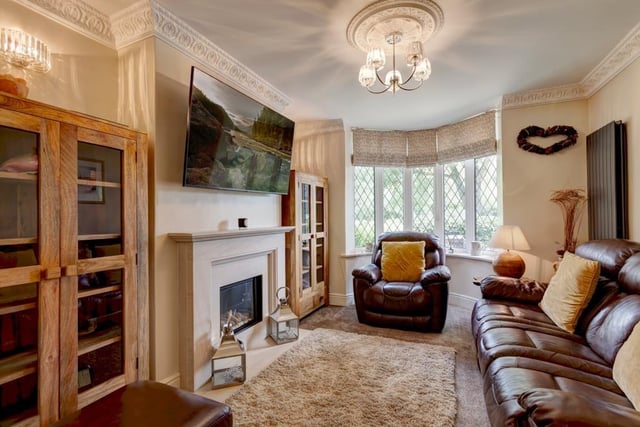 The cosy sitting room has views of the park through the front-facing, double-glazed bay window. It includes a feature remote-controlled gas fire with a limestone mantel, surround and hearth.