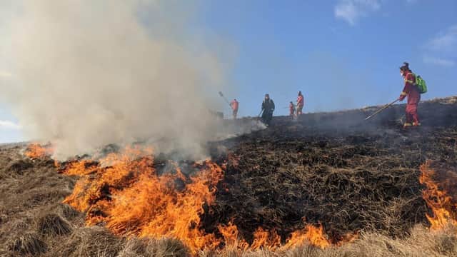 Firefighters tackling the large moorland fire
